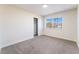 Bedroom with a large window offering natural light and a closet at 308 Fox Cir, Las Vegas, NV 89107