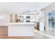 Modern, white kitchen with stainless steel appliances, ample counter space and backyard access at 308 Fox Cir, Las Vegas, NV 89107