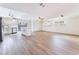 Open concept living room features wood-look floors, neutral paint, and abundant natural light at 308 Fox Cir, Las Vegas, NV 89107