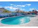 Beautiful in-ground pool surrounded by an art wall at 308 Fox Cir, Las Vegas, NV 89107