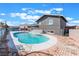 Large, inviting in-ground pool surrounded by a brick patio at 308 Fox Cir, Las Vegas, NV 89107