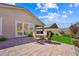 Backyard with patio, dining set and view of covered patio at 32 Via Del Fiume, Henderson, NV 89011