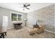 Bedroom with a ceiling fan, window, desk, accent chair, and carpeted floor at 32 Via Del Fiume, Henderson, NV 89011