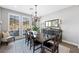 Beautiful dining room with chandelier, lots of light, and modern decor at 32 Via Del Fiume, Henderson, NV 89011