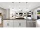 Modern kitchen island with sleek countertops and stainless steel appliances, perfect for entertaining and everyday living at 32 Via Del Fiume, Henderson, NV 89011