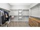 Large walk-in closet with built-in shelves, storage, and a chest of drawers at 32 Via Del Fiume, Henderson, NV 89011