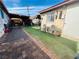 Backyard featuring brick pavers, artificial turf, and various seating areas at 3601 Chevy Chase Ave, Las Vegas, NV 89110