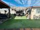 Outdoor backyard seating area with artificial turf at 3601 Chevy Chase Ave, Las Vegas, NV 89110