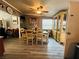 Bright dining room boasts a classic china cabinet, a ceiling fan, and a large dining table for gathering at 3601 Chevy Chase Ave, Las Vegas, NV 89110