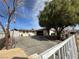 Well-maintained driveway leading to the attached garage, complemented by mature trees and privacy fence at 3601 Chevy Chase Ave, Las Vegas, NV 89110