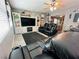 Cozy living room featuring leather recliners, large TV, and built-in shelving for ample storage at 3601 Chevy Chase Ave, Las Vegas, NV 89110