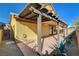 Charming covered back patio with desert landscaping offering a private outdoor living space at 3932 Maldive Isle Ct, Las Vegas, NV 89129