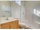 Clean bathroom featuring a shower over bath and wood vanity at 3932 Maldive Isle Ct, Las Vegas, NV 89129