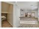 Hallway with wood-look flooring leads to open living spaces, enhancing the home's flow at 3932 Maldive Isle Ct, Las Vegas, NV 89129