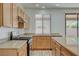 Well-lit kitchen boasts modern gas range and stainless steel sink with natural light from window at 3932 Maldive Isle Ct, Las Vegas, NV 89129