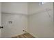 Neat laundry room with white walls, vinyl flooring, and wire shelving for organized storage at 3932 Maldive Isle Ct, Las Vegas, NV 89129