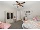 Bright bedroom featuring a ceiling fan, an armoire, and a vanity set at 452 Triple Falls St, Indian Springs, NV 89018