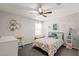 Bedroom featuring a ceiling fan, a desk, and a twin bed at 452 Triple Falls St, Indian Springs, NV 89018