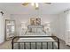 Serene bedroom with a metal-frame bed, neutral décor, and soft lighting creating a relaxing atmosphere at 452 Triple Falls St, Indian Springs, NV 89018