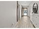 Hallway featuring hardwood floors and an entry door at 452 Triple Falls St, Indian Springs, NV 89018