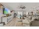 Inviting living room featuring stylish decor, wood-look tile flooring, and an open layout perfect for entertaining at 452 Triple Falls St, Indian Springs, NV 89018