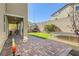 Spacious backyard featuring artificial grass, pavers, a swing, and a trampoline at 4813 Stony Hill St, North Las Vegas, NV 89031