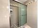 Bathroom with shower, glass door, and decorative tile at 5255 Autumn Sky Rd, Las Vegas, NV 89118