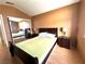 Bedroom with wood-look flooring, a bed, and sliding mirrored closet at 5255 Autumn Sky Rd, Las Vegas, NV 89118