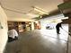 View of the garage with shelving and a white car visible through the open garage door at 5255 Autumn Sky Rd, Las Vegas, NV 89118