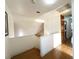 Well-lit upstairs hallway featuring a railing and views of the stairs leading below at 5255 Autumn Sky Rd, Las Vegas, NV 89118