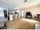 Open living area features tile flooring, a television, and overlooks the kitchen area at 5255 Autumn Sky Rd, Las Vegas, NV 89118