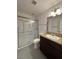 Bathroom with granite countertop, and a glass door shower, is both stylish and functional at 5312 W Oakey Blvd, Las Vegas, NV 89146