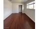 Bedroom featuring a window and a closet with sliding doors provides storage space at 5312 W Oakey Blvd, Las Vegas, NV 89146