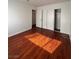 Bedroom with wooden floor and a closet providing functional storage solutions at 5312 W Oakey Blvd, Las Vegas, NV 89146