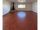 Open living space featuring a fireplace, laminate flooring, and bright natural light at 5312 W Oakey Blvd, Las Vegas, NV 89146