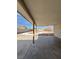 Covered patio view of a bare landscaped backyard with a concrete path at 5312 W Oakey Blvd, Las Vegas, NV 89146