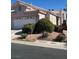 Charming single-story home with a well-maintained front yard and a two-car garage at 5366 Runningbrook Rd, Las Vegas, NV 89120