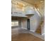 Open concept living room with staircase, high ceilings, and tile flooring, creating a spacious atmosphere at 5758 Yellowcrest Ct, Las Vegas, NV 89113