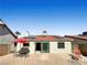 Cozy backyard features a patio, gravel landscaping, and partial shade at 592 Grimsby Ave, Henderson, NV 89014