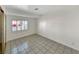 Bedroom with tile flooring, natural light and shuttered windows at 592 Grimsby Ave, Henderson, NV 89014