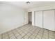 Bedroom boasts tile flooring and closet space at 592 Grimsby Ave, Henderson, NV 89014