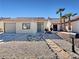 Delightful single-story home with xeriscaping and a welcoming walkway at 592 Grimsby Ave, Henderson, NV 89014