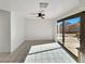 Living room features ceramic tile flooring, a sliding glass door, and neutral paint at 592 Grimsby Ave, Henderson, NV 89014