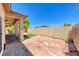 This backyard features a covered patio, rock landscaping and a privacy wall at 5952 Long Bay St, Las Vegas, NV 89148