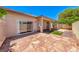 Backyard patio with ample space, featuring a covered area, stone flooring, and lush landscaping at 5952 Long Bay St, Las Vegas, NV 89148