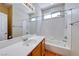 Bright bathroom featuring a vanity with a mirror and a shower-tub combo at 5952 Long Bay St, Las Vegas, NV 89148