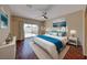 Bright bedroom featuring a ceiling fan, sliding glass door, and tasteful decor at 5952 Long Bay St, Las Vegas, NV 89148