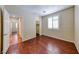 This bright bedroom features wood floors, natural light and plantation shutters at 5952 Long Bay St, Las Vegas, NV 89148