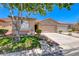 Inviting single-story home with a two-car garage and manicured landscaping at 5952 Long Bay St, Las Vegas, NV 89148