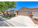 Charming single-story home showcasing a well-manicured front yard and a two car garage at 5952 Long Bay St, Las Vegas, NV 89148